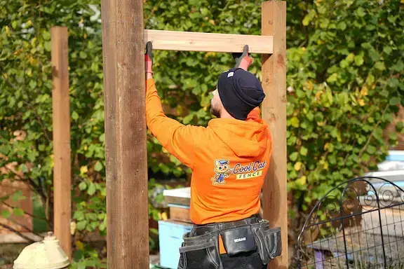 The expert team at our fence company in Seattle standing in front of the company vehicle.