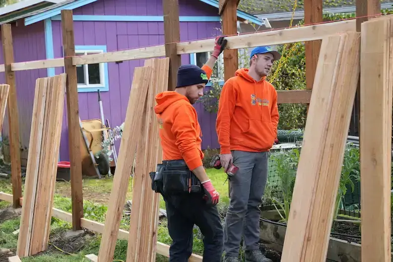 Expert installers from our fence company in Seattle performing a professional wood fence installation using premium cedar.