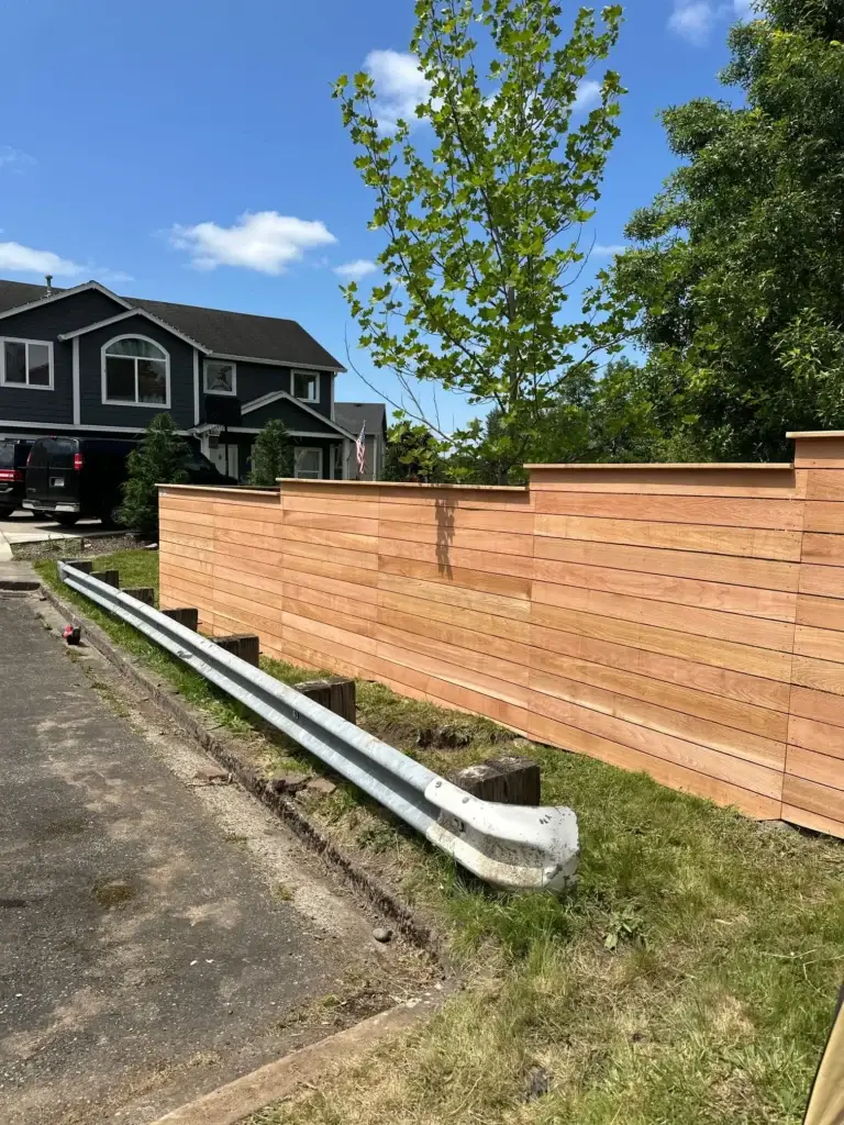 Tiered wooden barrier showcased in a Horizontal Cedar and Hogwire Fence Installation in Camas.